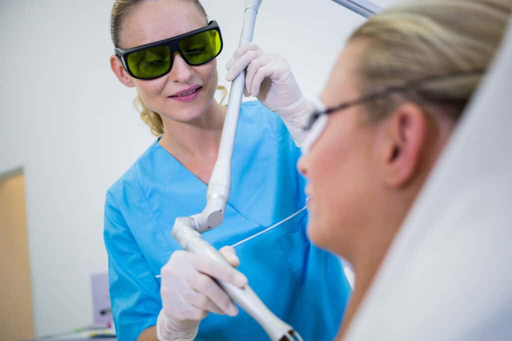 Laser gum surgery treatment in Timonium with a periodontist using advanced laser technology on a patient.