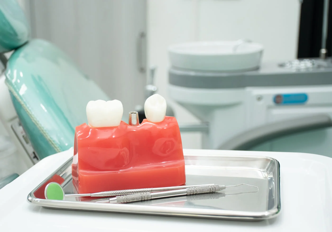 Dental implant model on a tray in a periodontal office